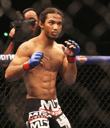 Decatur High School graduate Ben Henderson defended his World Extreme Cagefighting 155-pound championship by tapping out Donald Cerrone at WEC 48 Saturday night at Arco Arena in Sacramento. Henderson fought in front of over 14