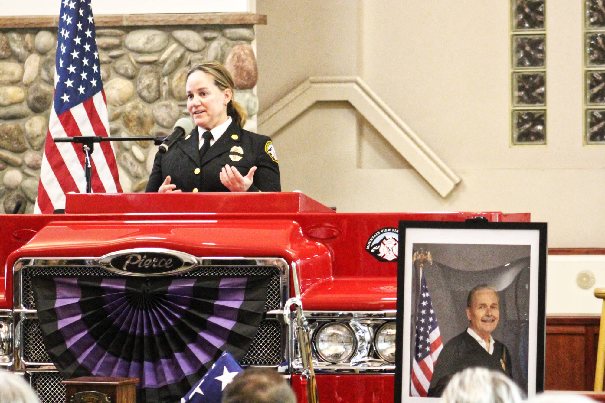 Mountain View Fire and Rescues new Fire Chief Dawn Judkins welcomed everyone to former Chief Greg Smiths Celebration of Life service at the Muckleshoot Pentecostal Church last Monday. The service started out with an honor guard and procession bringing in an urn, flag, and firefighter helmet. Photos by Ray Miller-Still