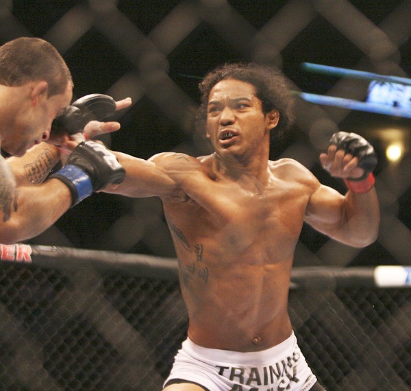 Decatur High School graduate Benson Henderson won a split decision over Frankie Edgar Saturday at UFC 150 in Denver to retain his UFC lightweight championship.